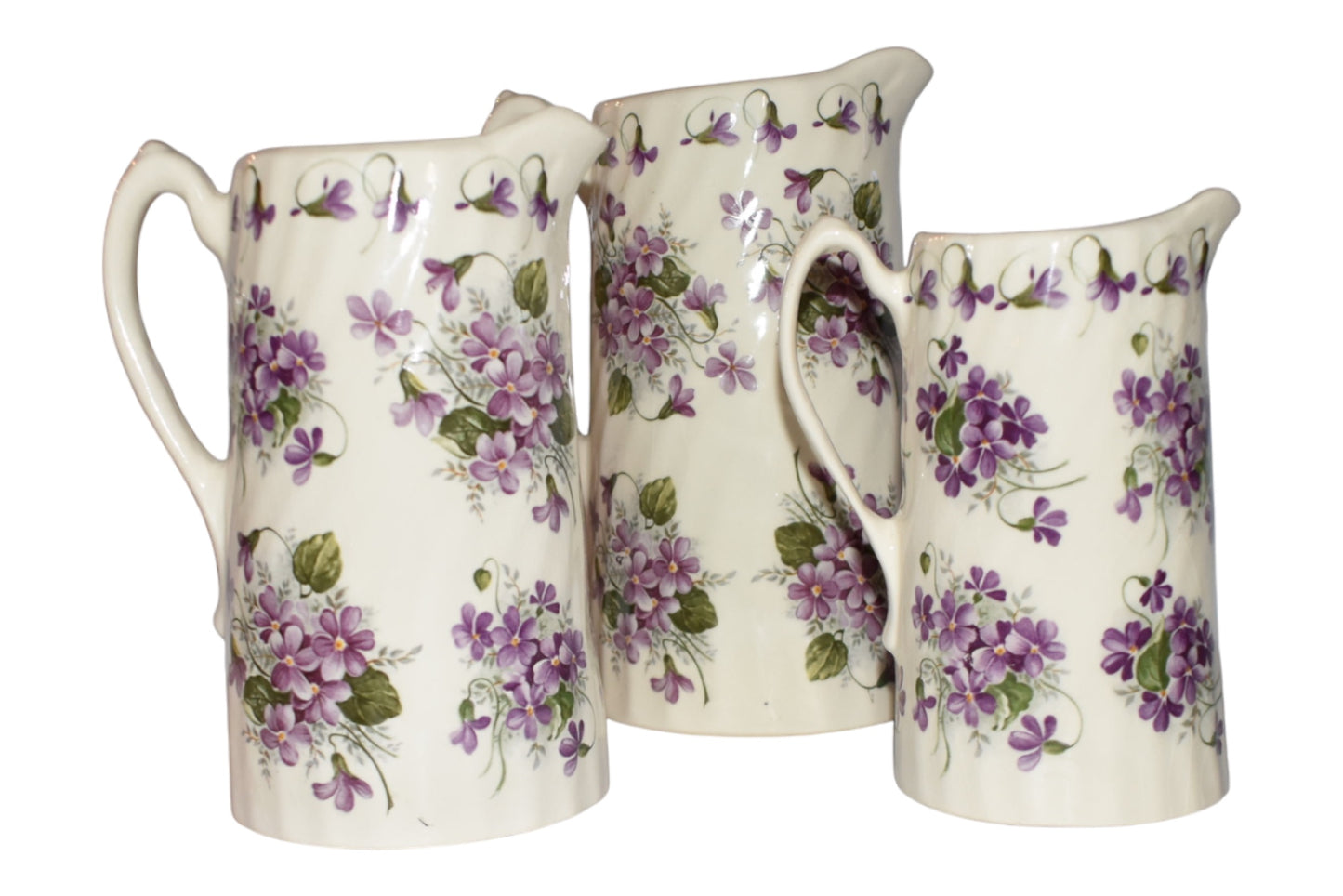 Set of Three English Violet Pitchers